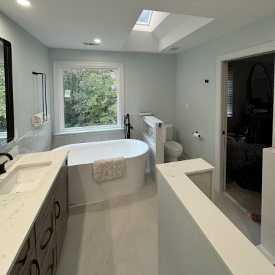 Modern bathroom with skylight and recessed lighting