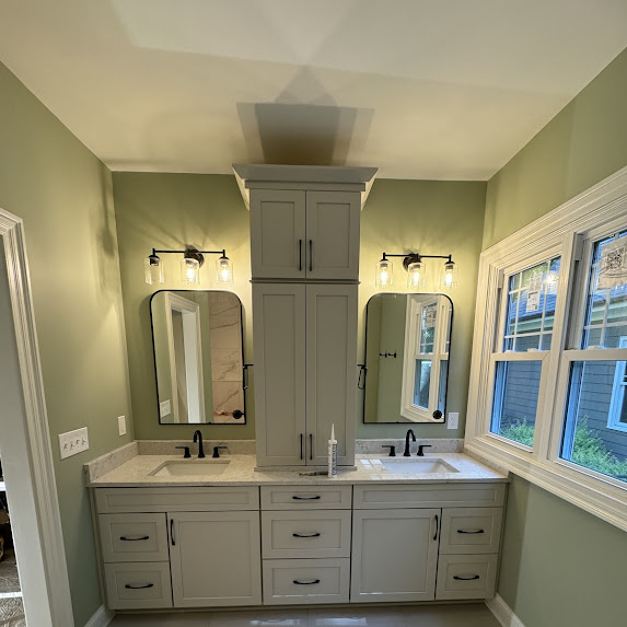 Sage green bathroom vanity with dual sinks